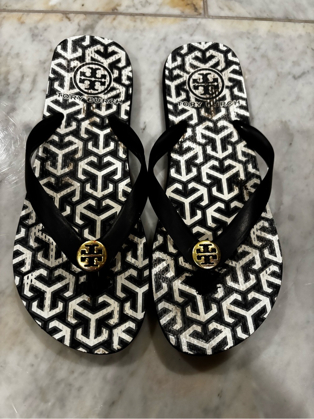 Tory Burch Black & White Geometric Logo Flip Flops with Gold Medallions